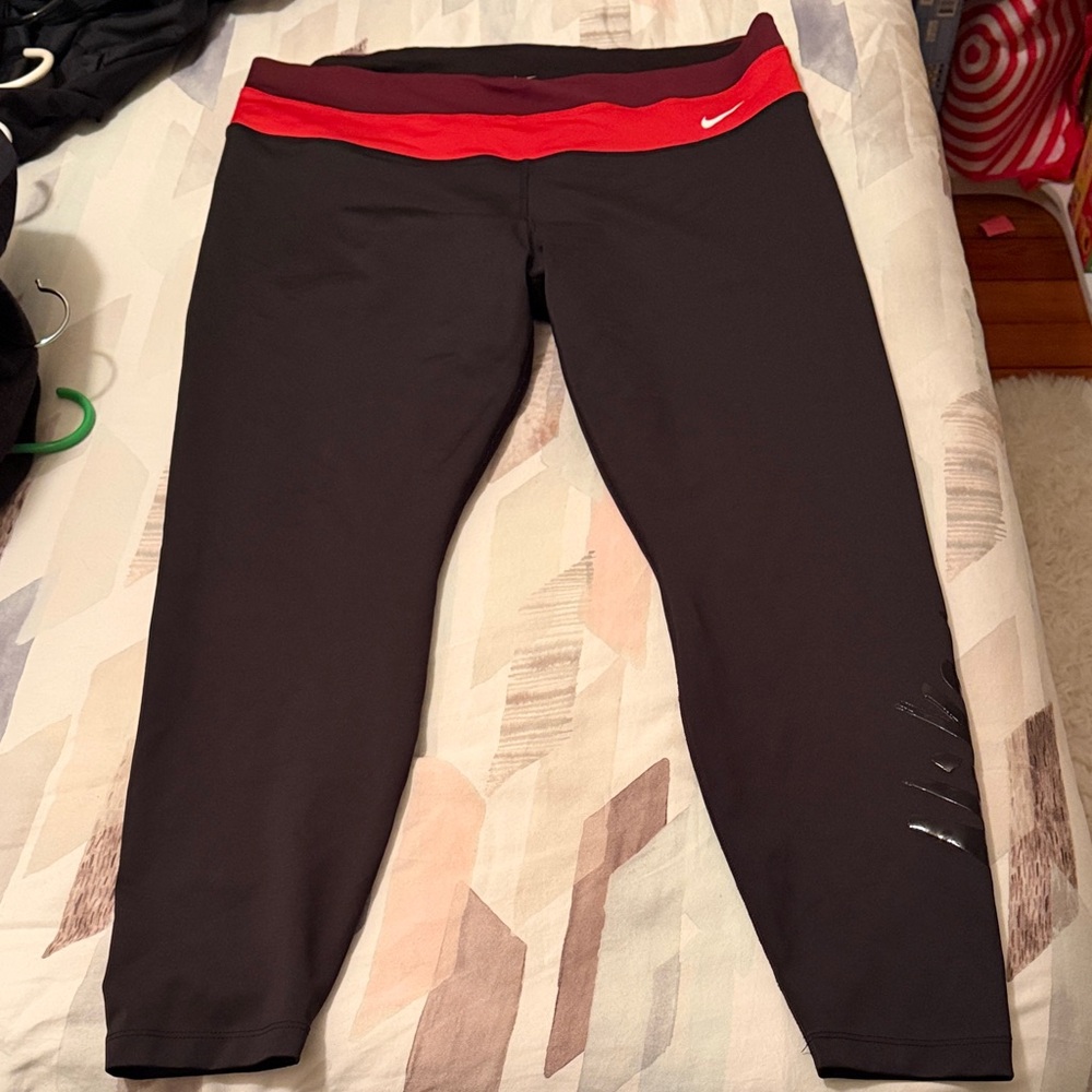 Nike Black Leggings with Vibrant Red and Maroon Accent Waistband